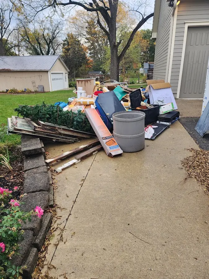 Dumpster being loaded with debris for Commercial Dumpster Rental in Abingdon